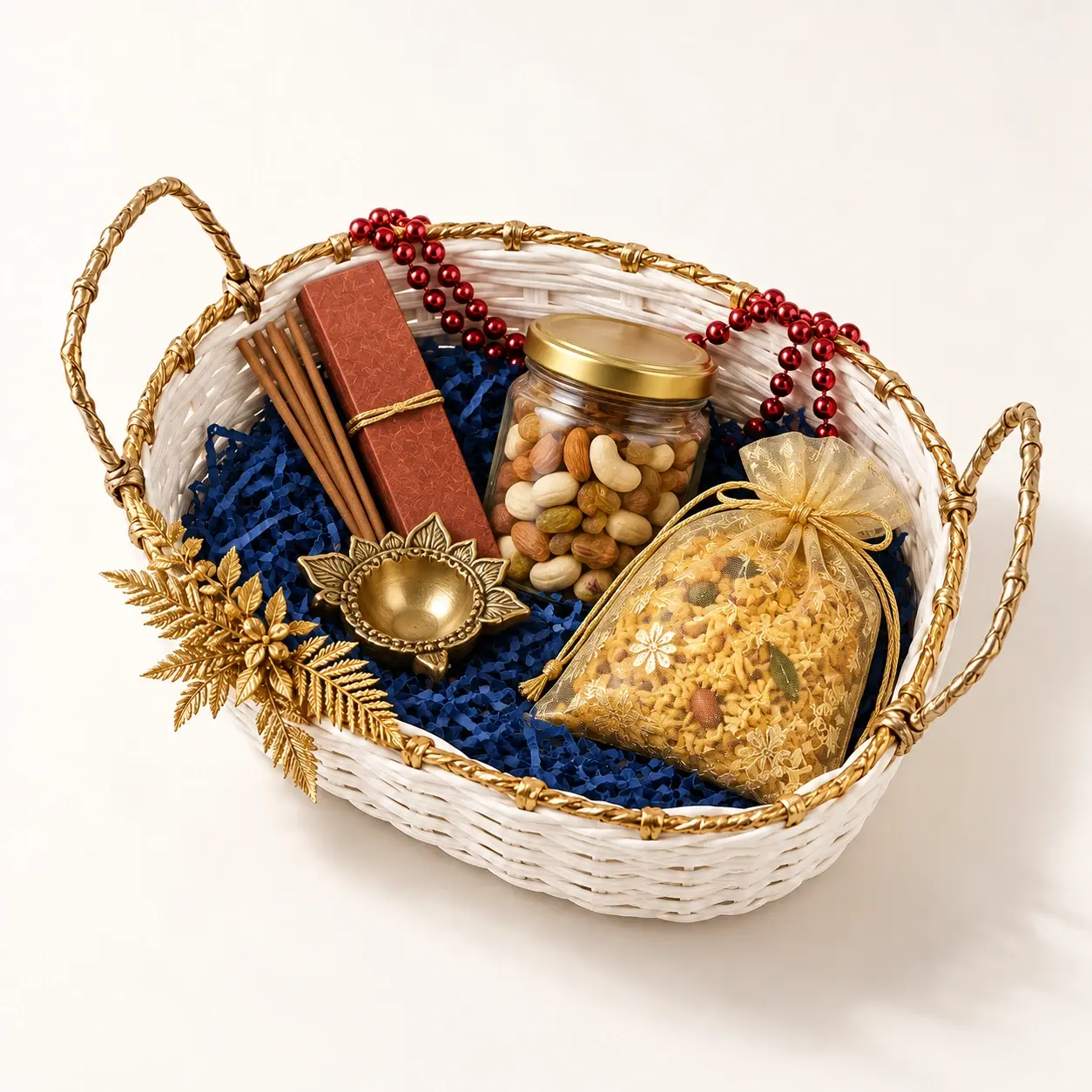 Festive Oval Presentation Basket filled hamper — White oval woven basket with navy filler, red bead strand and gold accent